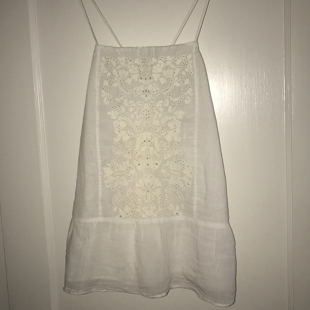 White tank top, good condition with no stains.